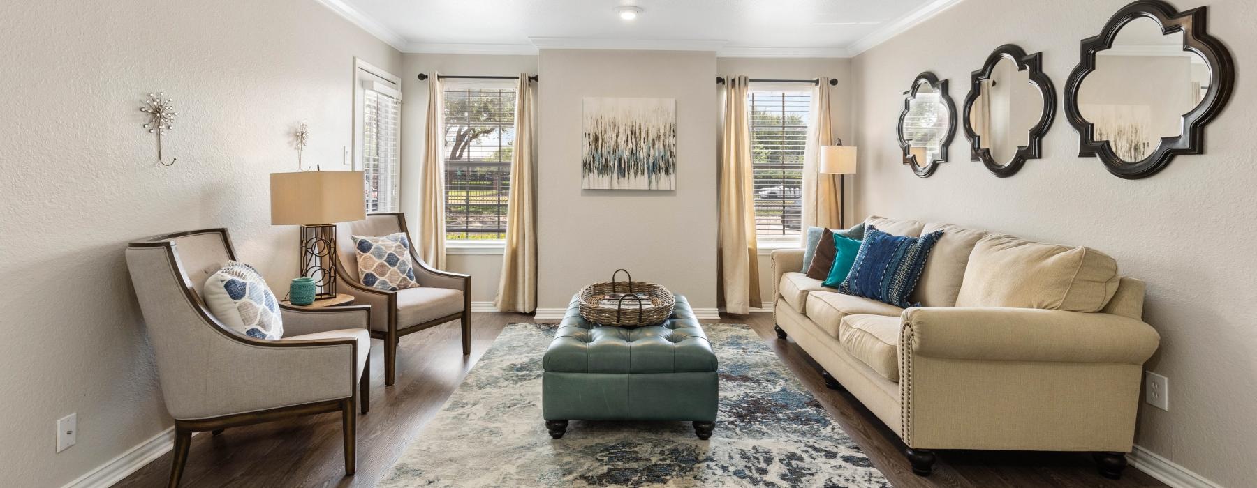a living room with a couch and a chair