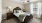 a bedroom with a bed and a fan