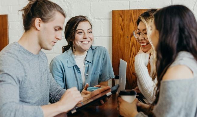 a group of people sitting at a table